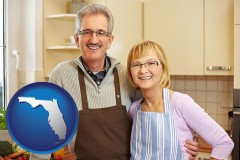 florida map icon and a senior couple standing in their apartment kitchen