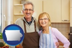 iowa map icon and a senior couple standing in their apartment kitchen