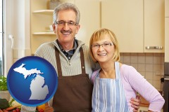 michigan map icon and a senior couple standing in their apartment kitchen
