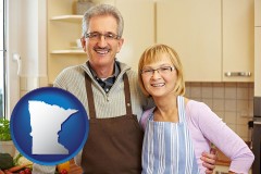 minnesota map icon and a senior couple standing in their apartment kitchen