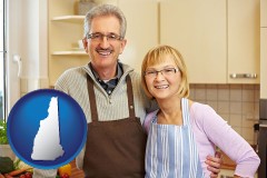 new-hampshire map icon and a senior couple standing in their apartment kitchen