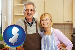 new-jersey map icon and a senior couple standing in their apartment kitchen