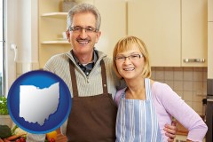 ohio map icon and a senior couple standing in their apartment kitchen