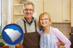 south-carolina map icon and a senior couple standing in their apartment kitchen