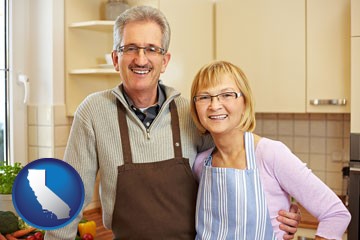 a senior couple standing in their apartment kitchen - with California icon