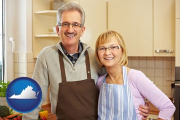 a senior couple standing in their apartment kitchen - with Virginia icon