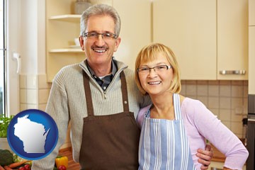 a senior couple standing in their apartment kitchen - with Wisconsin icon