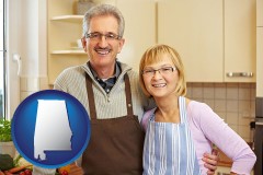 Alabama - a senior couple standing in their apartment kitchen